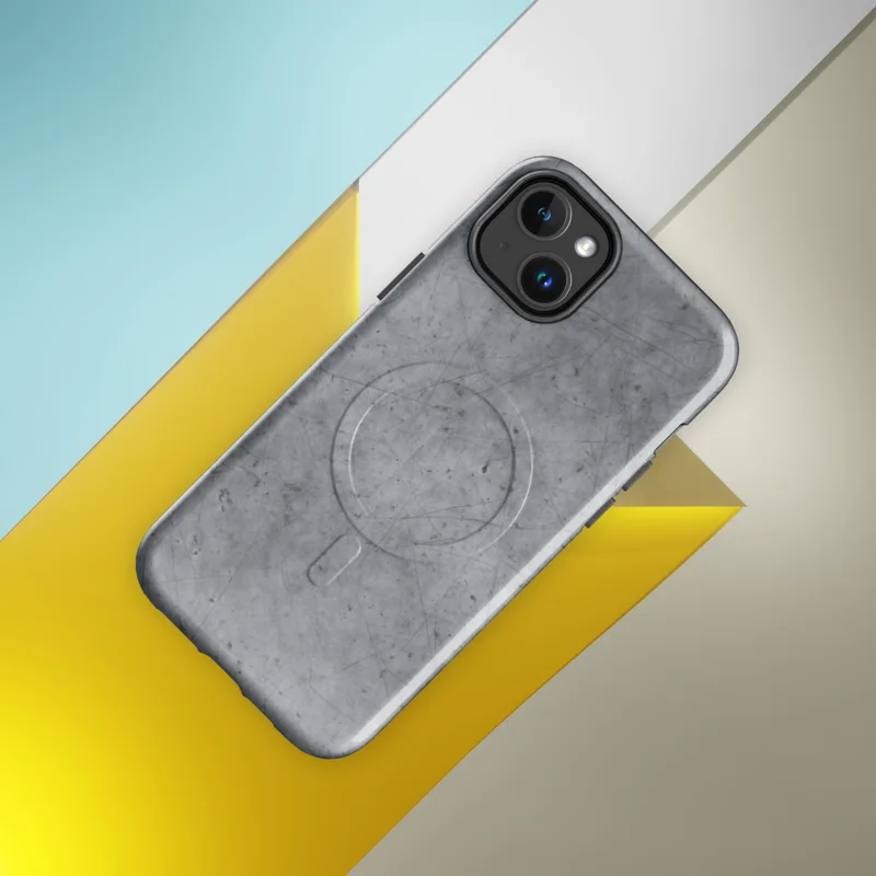 Glossy Scratched Steel Urban Armor MagSafe Tough Case for iPhone — weathered grey metal surface with fine random scratches