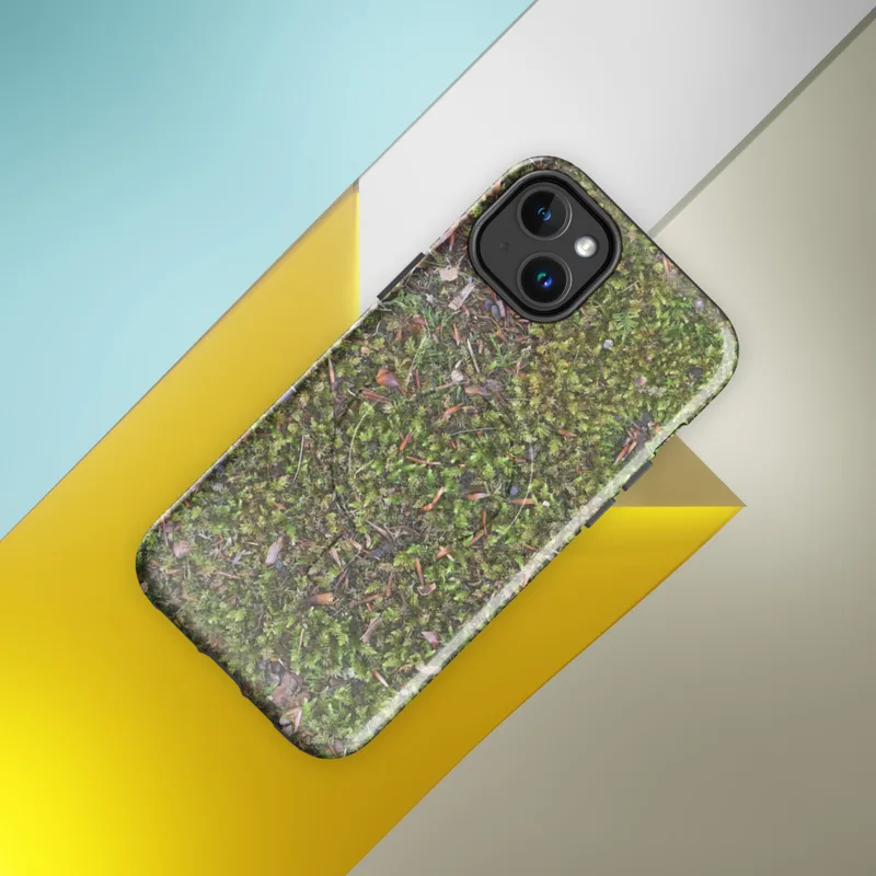 Glossy Forest Floor Mossy Ground MagSafe Tough Case for iPhone — top-down photorealistic view of green moss ground scattered