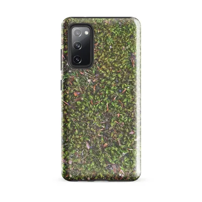 top-down view of dense green moss covered with scattered pine needles, small pebbles, and reddish-brown leaf fragments in natural forest tones on Glossy Forest Floor Moss Tough Case for Samsung - default - Front view