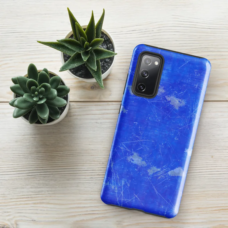 Glossy Electric Blue Storm Tough Case for Samsung — vivid cobalt blue surface covered in white scratch lines, gray ink