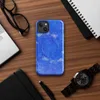 Glossy Electric Blue Splatter Storm MagSafe Tough Case for iPhone — vivid cobalt blue background covered in scattered