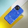 Glossy Electric Blue Splatter Storm MagSafe Tough Case for iPhone — vivid cobalt blue background covered in scattered