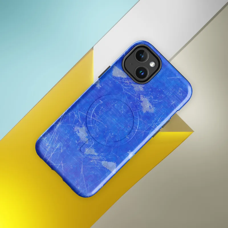 Glossy Electric Blue Splatter Storm MagSafe Tough Case for iPhone — vivid cobalt blue background covered in scattered