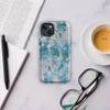 Glossy Frozen Tide Abstract MagSafe Tough Case for iPhone — layered abstract texture of icy blue, deep teal, and pale grey