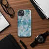 Glossy Frozen Tide Abstract MagSafe Tough Case for iPhone — layered abstract texture of icy blue, deep teal, and pale grey