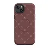 Matte Crimson Cross Stitch MagSafe Tough Case for iPhone — repeating white cross-stitch X marks and diagonal line stitches