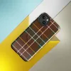Glossy Highland Tartan MagSafe Tough Case for iPhone — classic tartan plaid pattern in deep crimson red, forest green, gold