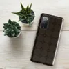 Glossy Dark Cobblestone Armor Tough Case for Samsung — repeating dark brown octagonal cobblestone tiles with deep shadowed