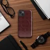 Glossy Crimson Grid Elegance MagSafe Tough Case for iPhone — repeating burgundy lattice pattern with softly blurred diamond