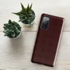 Glossy Crimson Lattice Elegance Tough Case for Samsung — repeating tufted diamond lattice pattern in deep burgundy and dark