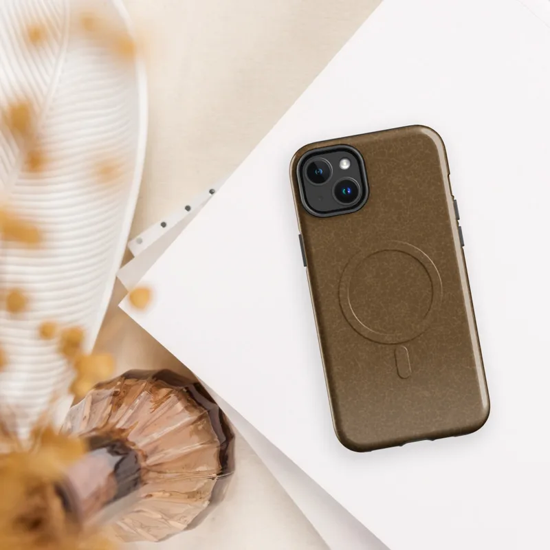 Glossy Weathered Leather Terrain MagSafe Tough Case for iPhone — crackled leather surface texture in warm amber and saddle