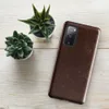 Glossy Worn Leather Heritage Tough Case for Samsung — aged mahogany leather surface with amber and tan crackle veining
