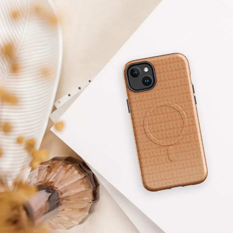 Glossy Warm Peach Knit Texture MagSafe Tough Case for iPhone — close-up repeating crochet knit texture in warm peach