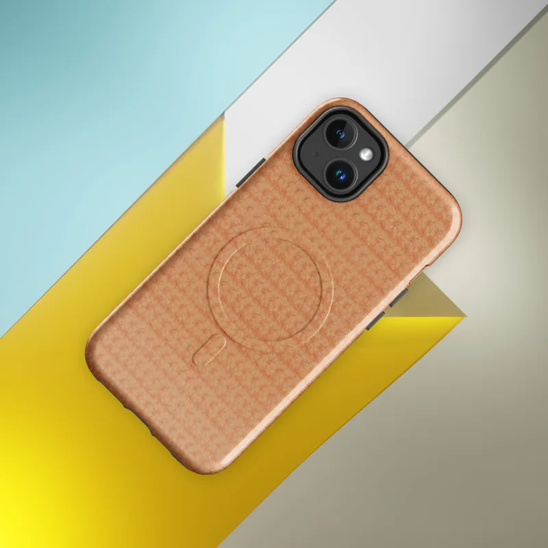 Glossy Warm Peach Knit Texture MagSafe Tough Case for iPhone — close-up repeating crochet knit texture in warm peach