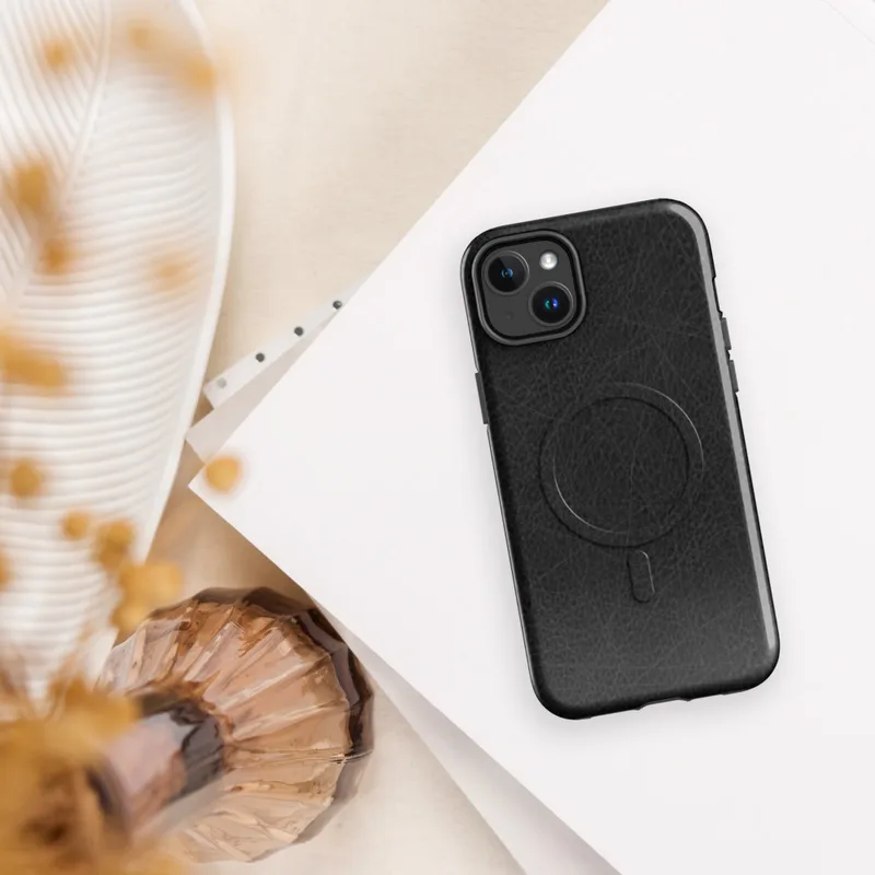 Glossy Scratched Black Leather MagSafe Tough Case for iPhone — close-up black leather surface with natural grain pores