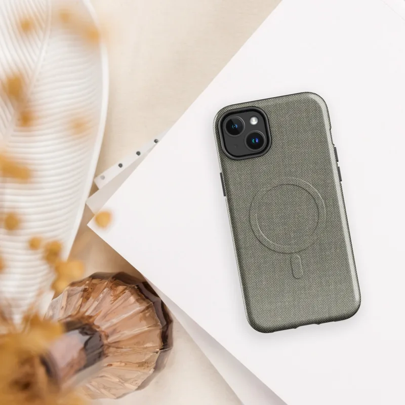 Glossy Urban Linen Texture MagSafe Tough Case for iPhone — close-up woven linen textile pattern in warm charcoal and muted