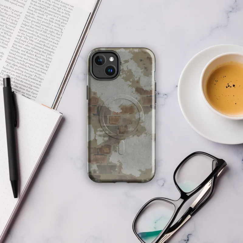 Glossy Crumbling Plaster Brick Wall MagSafe Tough Case for iPhone — peeling white and grey plaster revealing aged terracotta