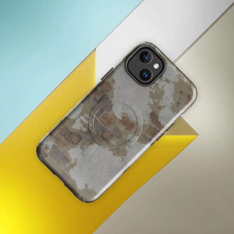 Glossy Crumbling Plaster Brick Wall MagSafe Tough Case for iPhone — peeling white and grey plaster revealing aged terracotta