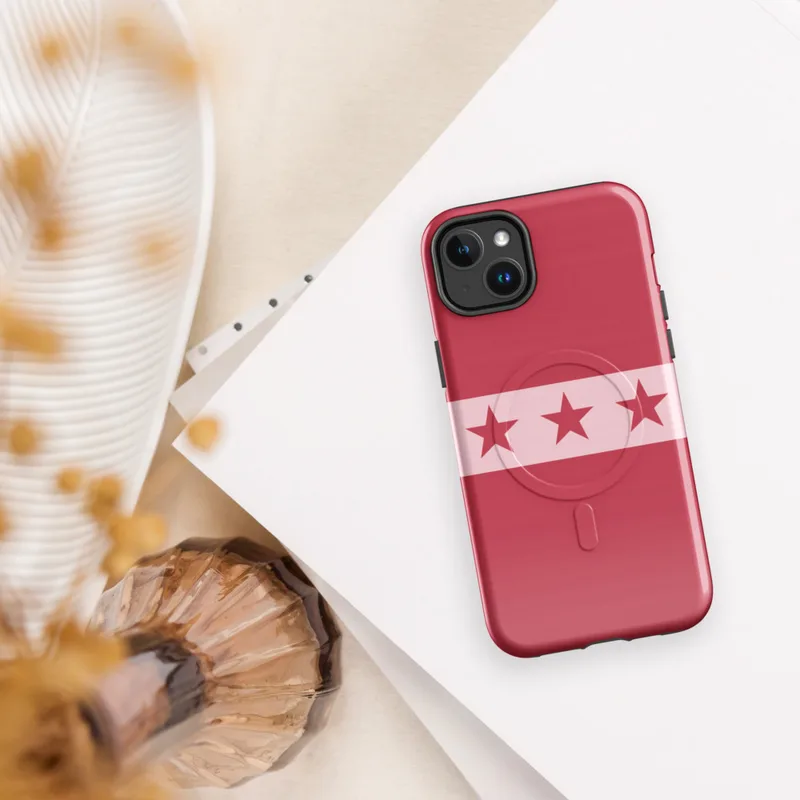 Glossy Red Star Band MagSafe Tough Case for iPhone — row of seven dark crimson five-pointed stars on a pale pink horizontal