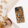 Glossy Circuit Siege Armor MagSafe Tough Case for iPhone — dense mechanical circuit board pattern in vivid orange, amber