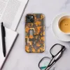 Glossy Circuit Siege Armor MagSafe Tough Case for iPhone — dense mechanical circuit board pattern in vivid orange, amber