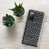 Glossy Iron Chain Armor Tough Case for Samsung — close-up pattern of interlocking steel chain mail rings with rust spots