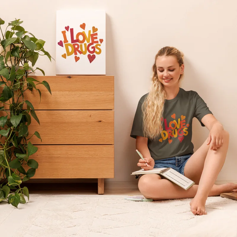 Army I Love Drugs Bold Statement Tee — bold chunky lettering reading I Love Drugs in warm orange red and yellow tones